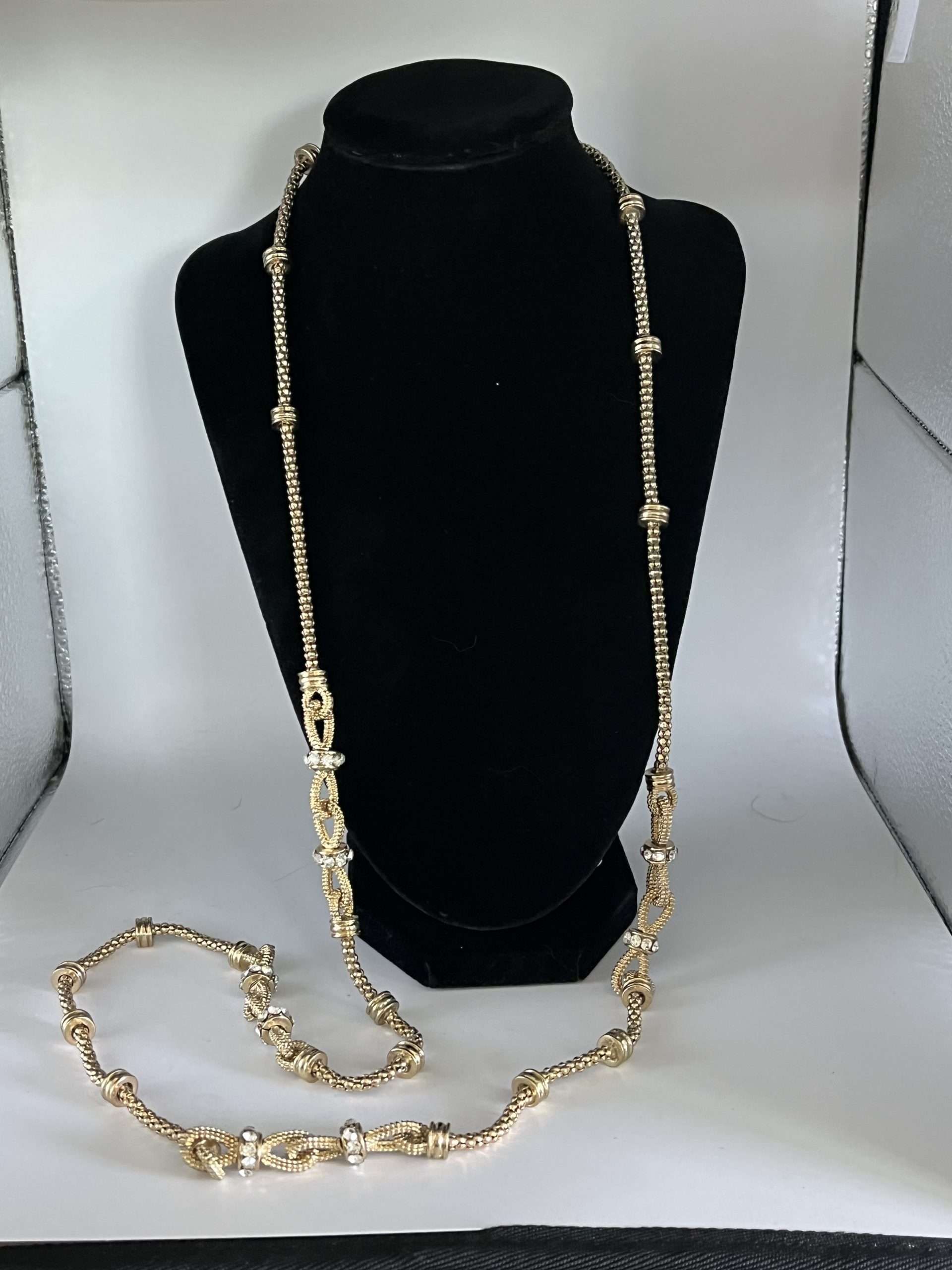 Very Long Gold Tone Necklace with Bows and Simulated Diamonds