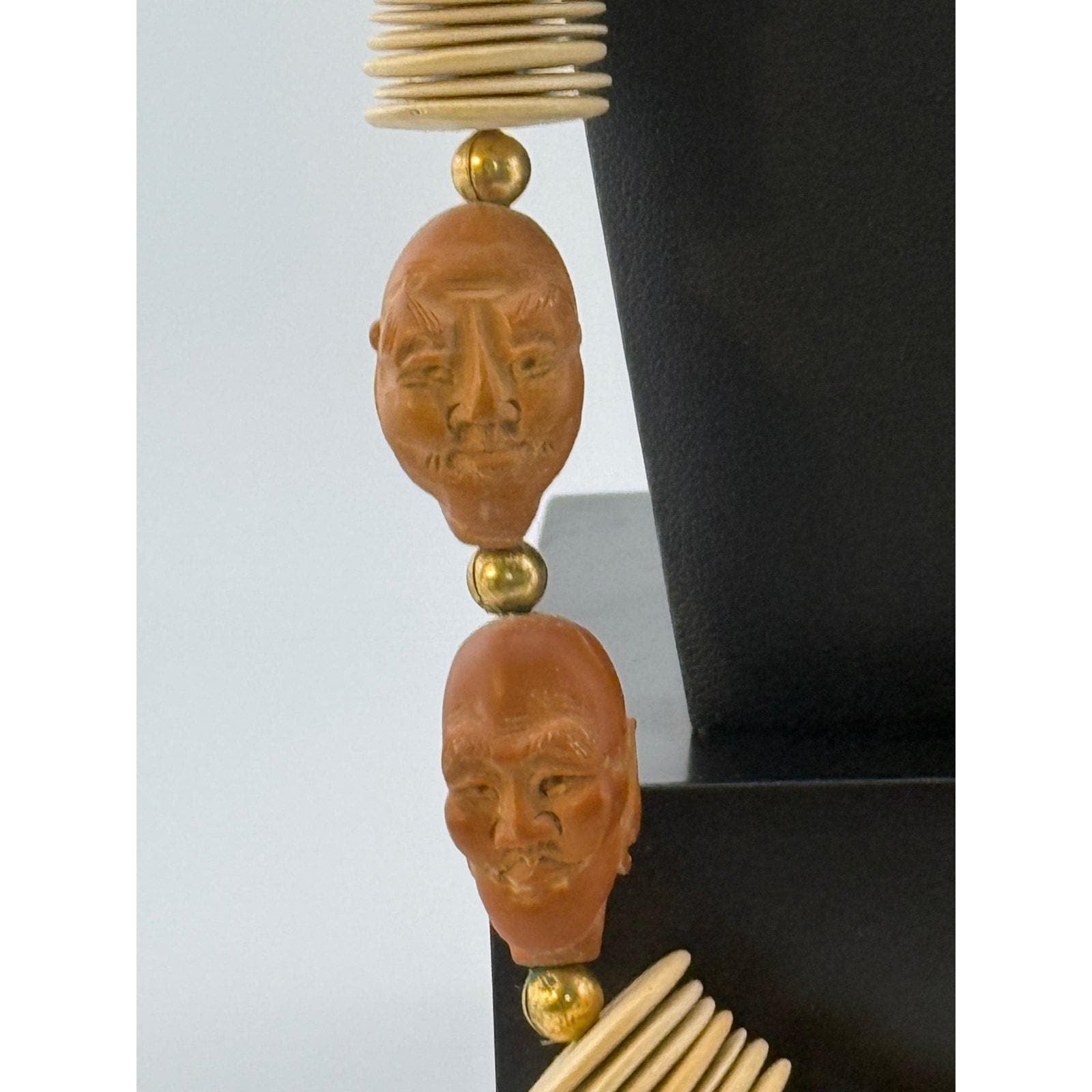 Wood Crafted Disk Carved Heads Necklace