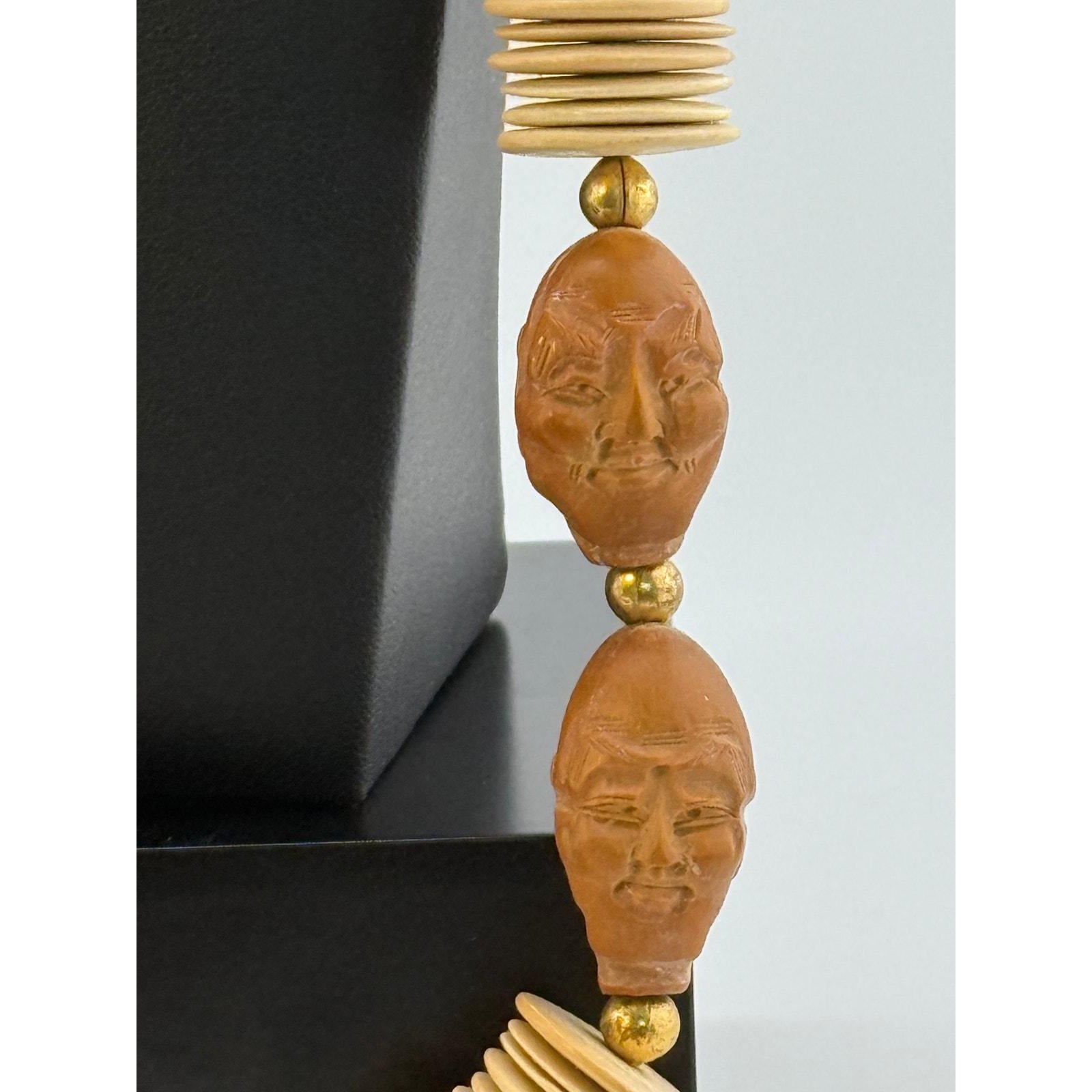 Wood Crafted Disk Carved Heads Necklace